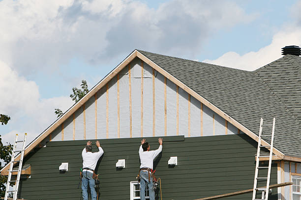 Professional Emergency Siding Repair technician working in Midland, OH